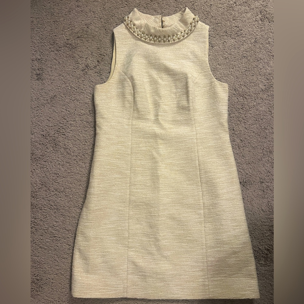 12. Thick golden material. Jewels around neck. Never worn.